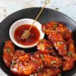 Hot Honey Chicken Wings 7 These Hot Honey Chicken Wings are baked or air-fried to crispy perfection, then tossed in a sweet-spicy glaze. The ultimate game-day or weeknight treat!